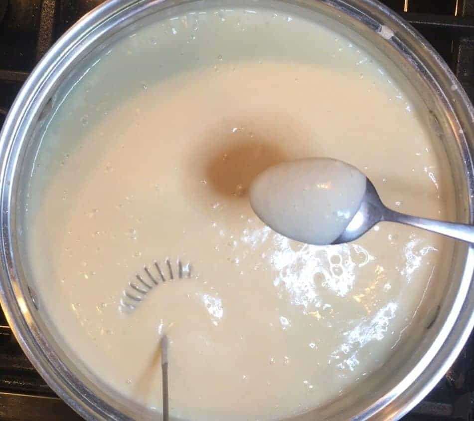 Bechamel sauce thickened to coat a spoon.