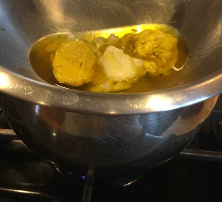 Shea butter & coconut oil melting over double boiler.