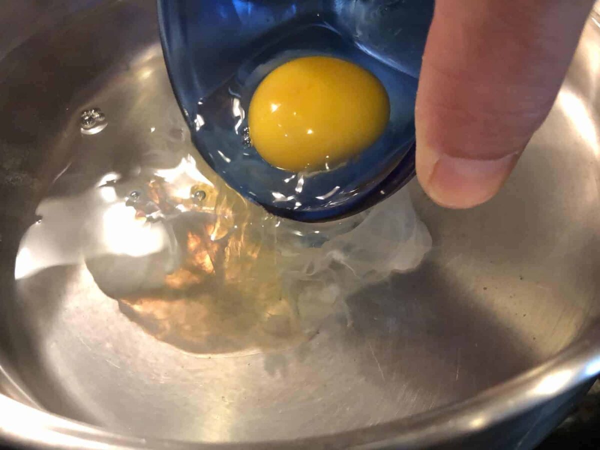 Give your water a slight swirl and carefully add the eggs.