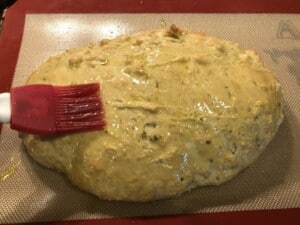 Herb Infused Ciabatta Bread - One last touch to help it brown (Photo by Erich Boenzli)