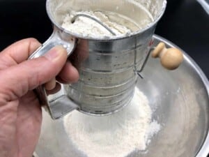 Herb Infused Ciabatta Bread - Sifting the flour (Photo by Erich Boenzli)