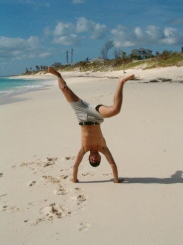 Erich doing a handstand on the beach in the Bahamas.