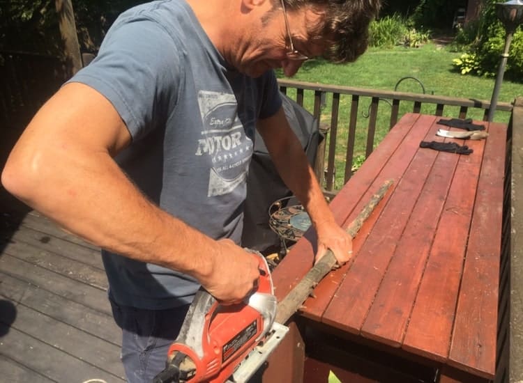 Cutting off the tiny branches with a jigsaw.