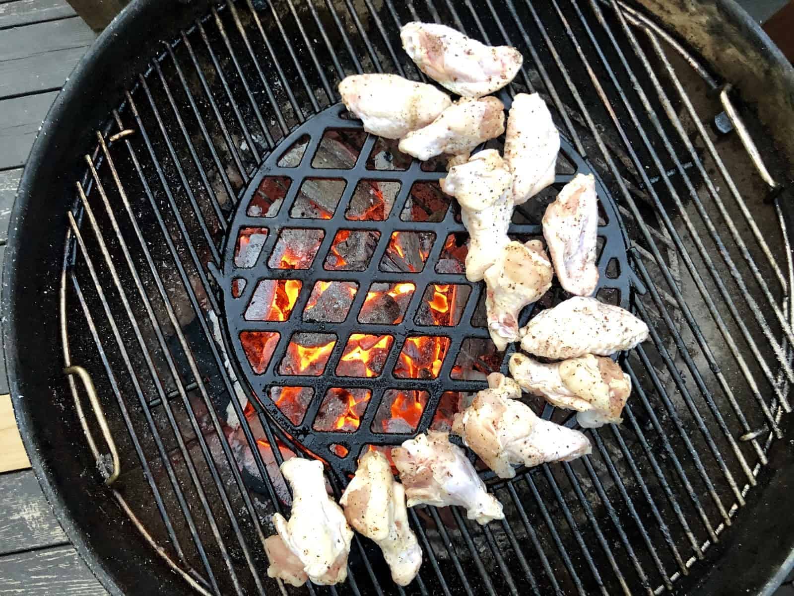 Wings over indirect heat on the grill.