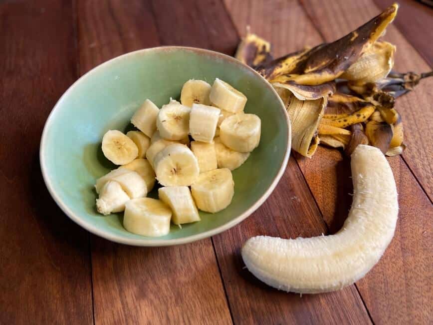 Bananas chopped in a bowl.