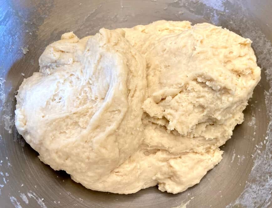 Dough forming together in a bowl.