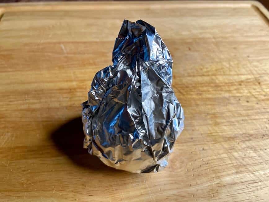 Onion wrapped in aluminum foil.