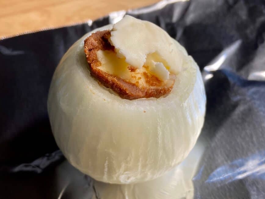 Top of onion stuffed with butter, bouillon, and soy sauce.