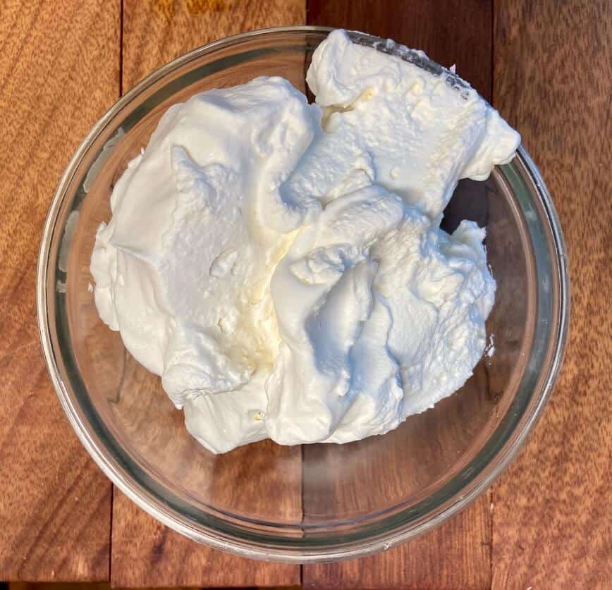 Chantilly whipped cream in a bowl.