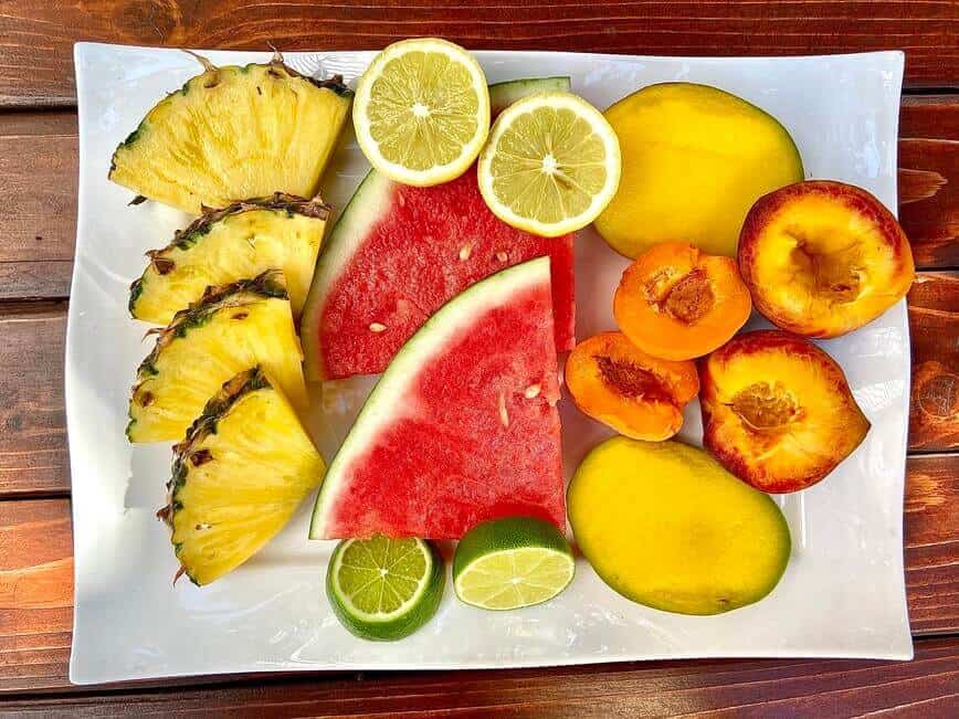 Sliced fruits on a platter.