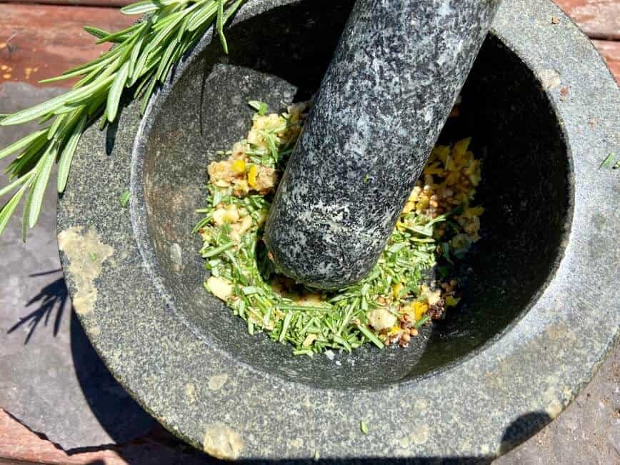 Grilled Leg of Lamb - making marinade in mortar and pestle (Photo by Erich Boenzli)