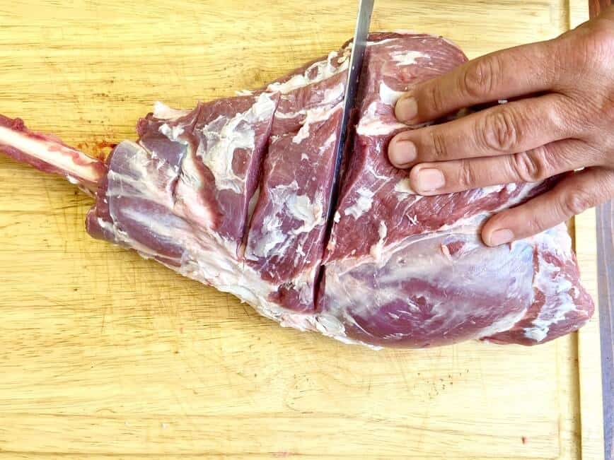 Grilled Leg of Lamb - preparing leg of lamb for marinade (Photo by Viana Boenzli)