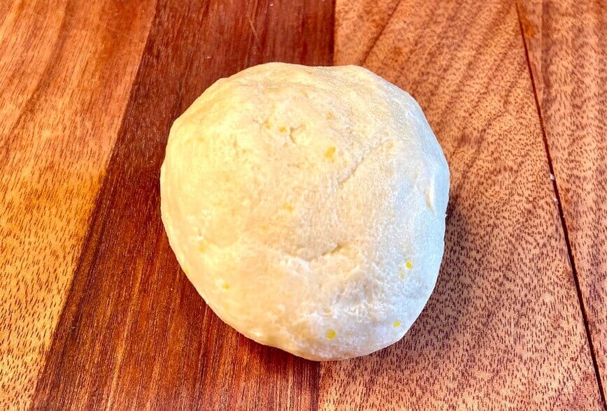 Pie crust dough rolled into a ball.