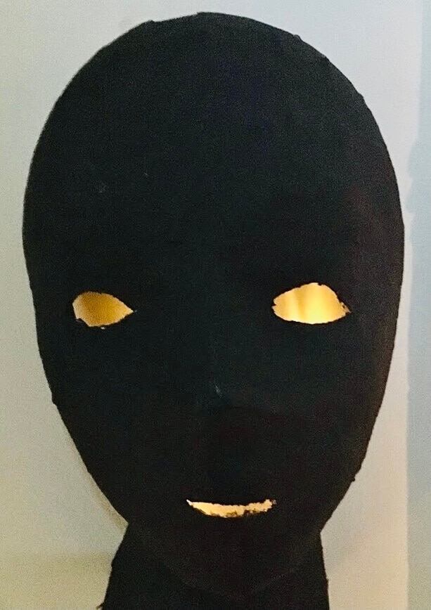 Mask with a light from behind shining through.