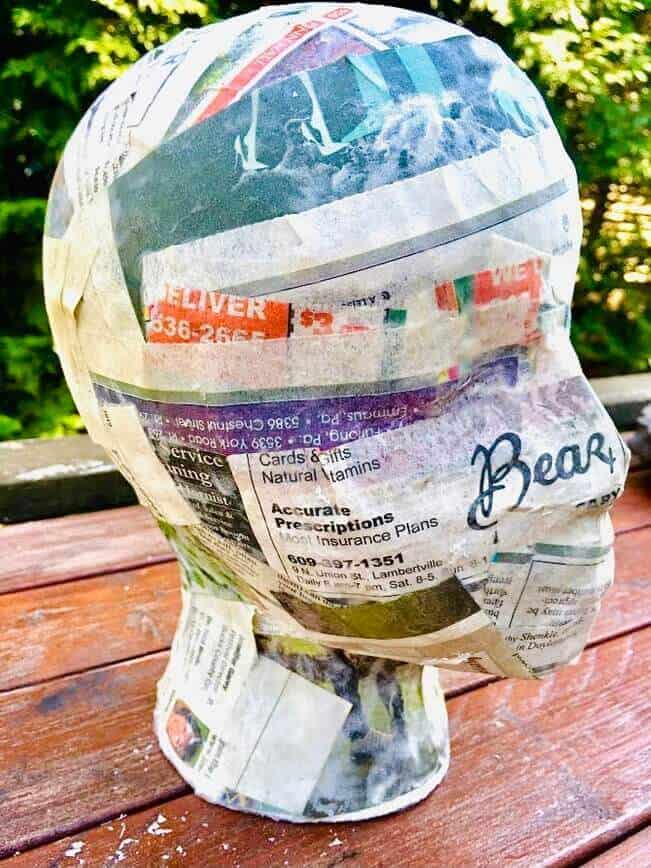 Head form covered in newspaper, but DON'T apply all the way around.