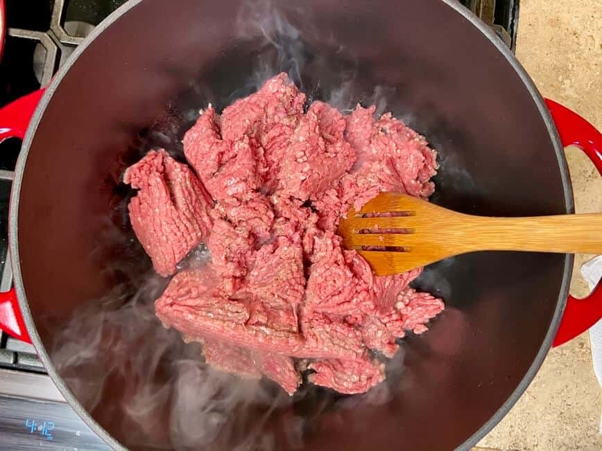 Browning the ground beef.