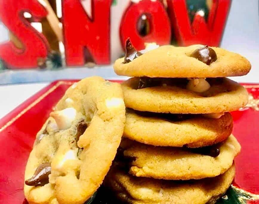 Cookies stacked up tall, with a snow sign behind.