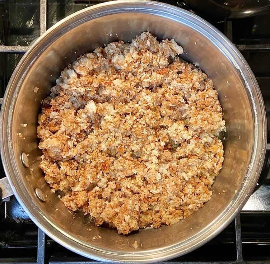 Mixing the stuffing mix in a pot.