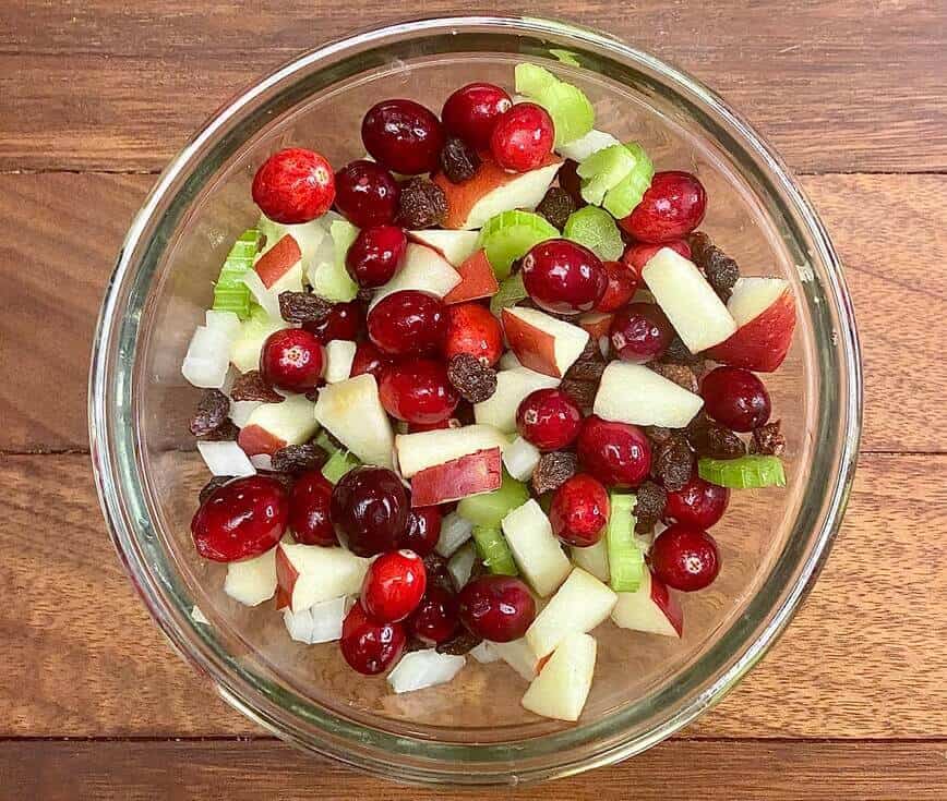 Fruits and veggies chopped in a bowl.
