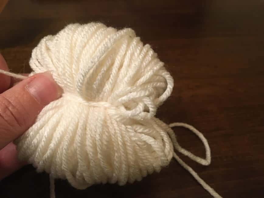 Loops of yarn tied in the middle.