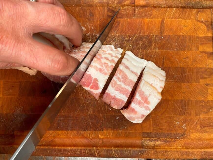 Slicing bacon.
