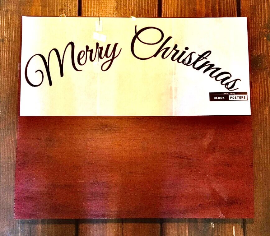 Lettering saying Merry Christmas printed on paper.