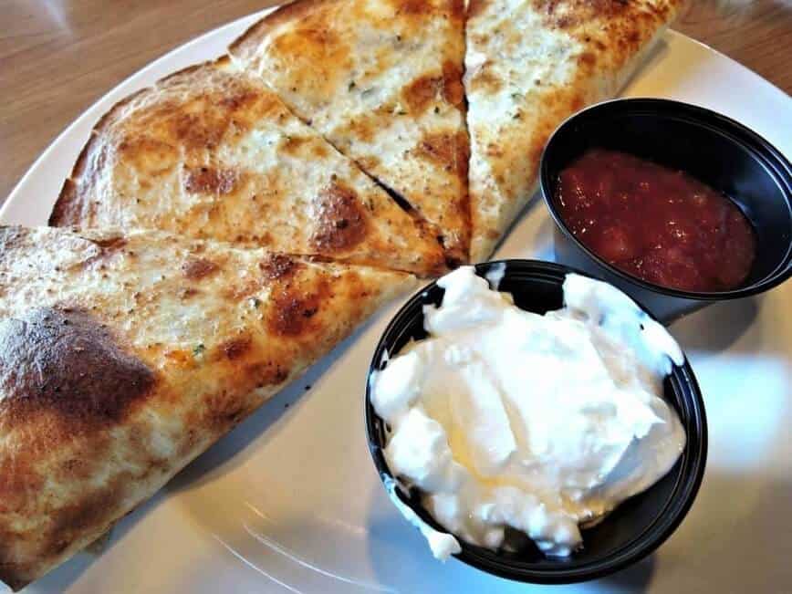 Sour cream with quesadillas.