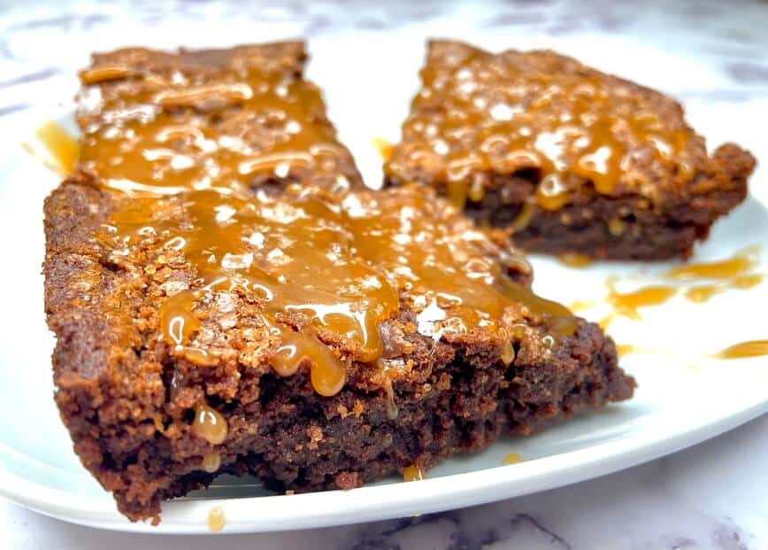 Brownies with caramel sauce on top.