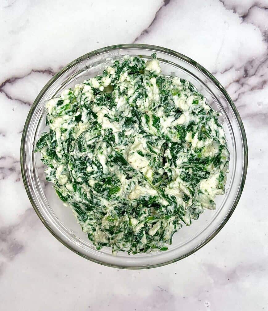 Making spinach ricotta filling.