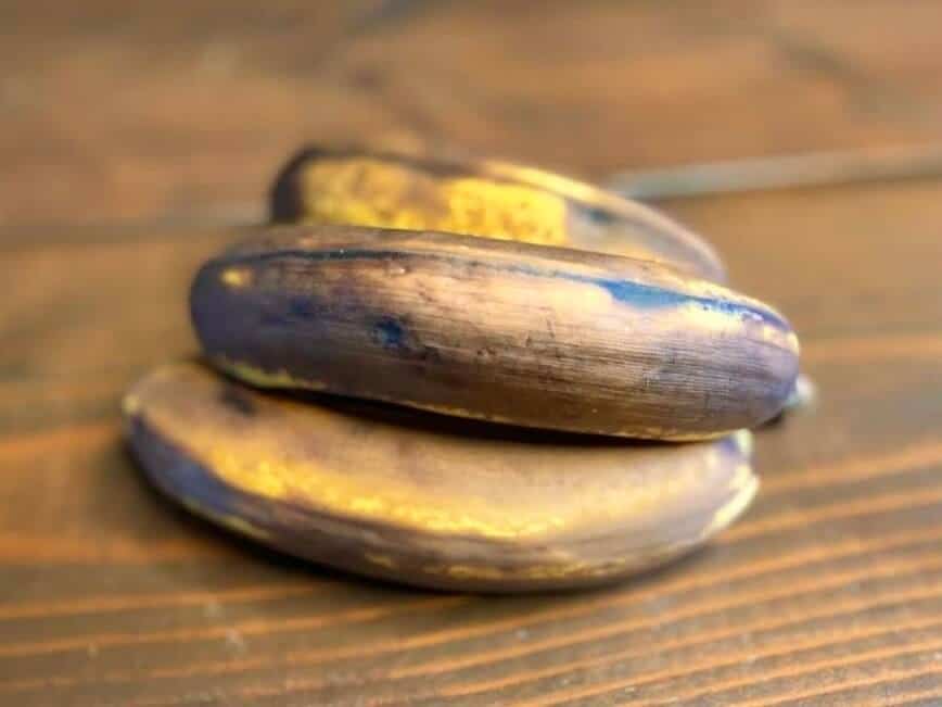 Overripe bananas on a wood table.