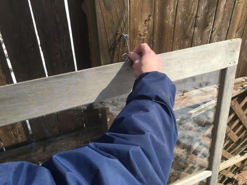 Hooking window to fence post.