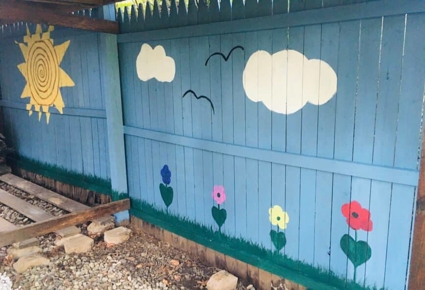 Painted Fence - Our painted woodshed (Photo by Viana Boenzli)