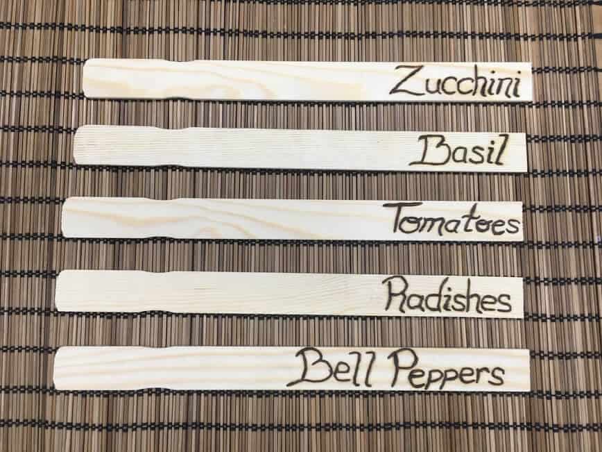 Names wood burned onto sticks.