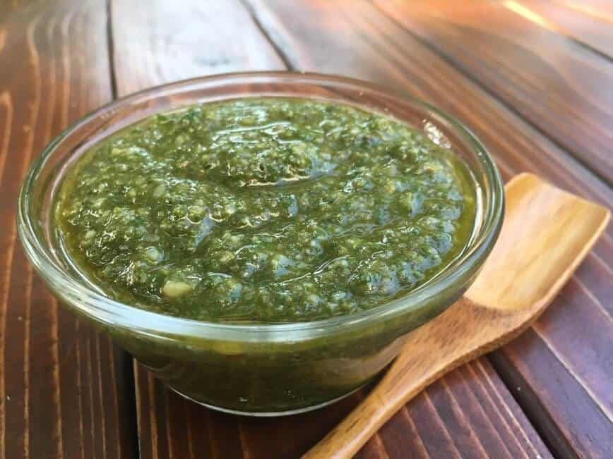 Pesto sauce in a glass bowl.