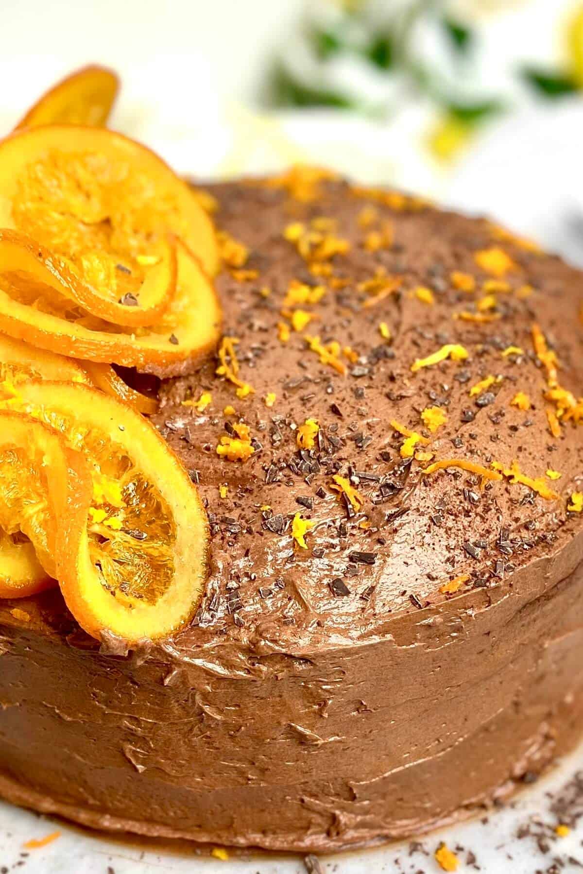 Closeup of oranges on top of cake.