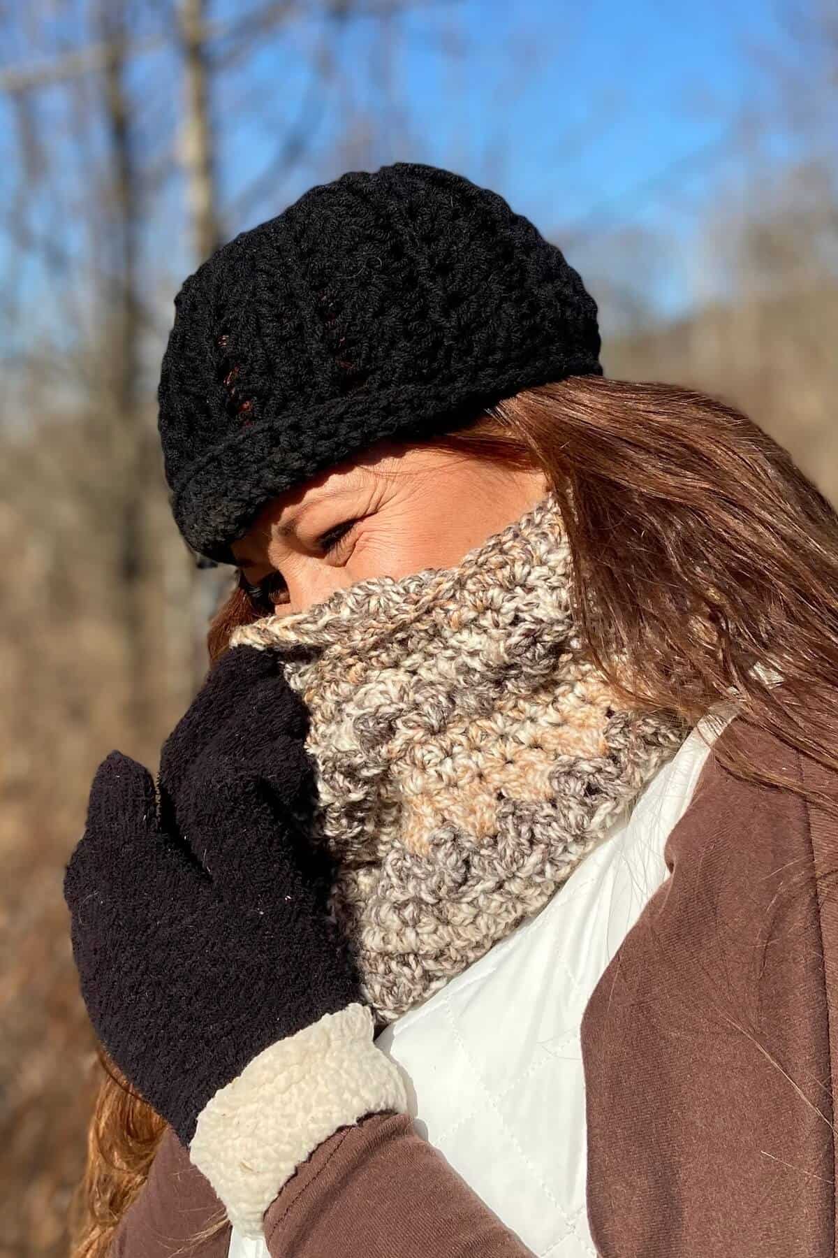 Pulling up the scarf to cover my mouth and nose.