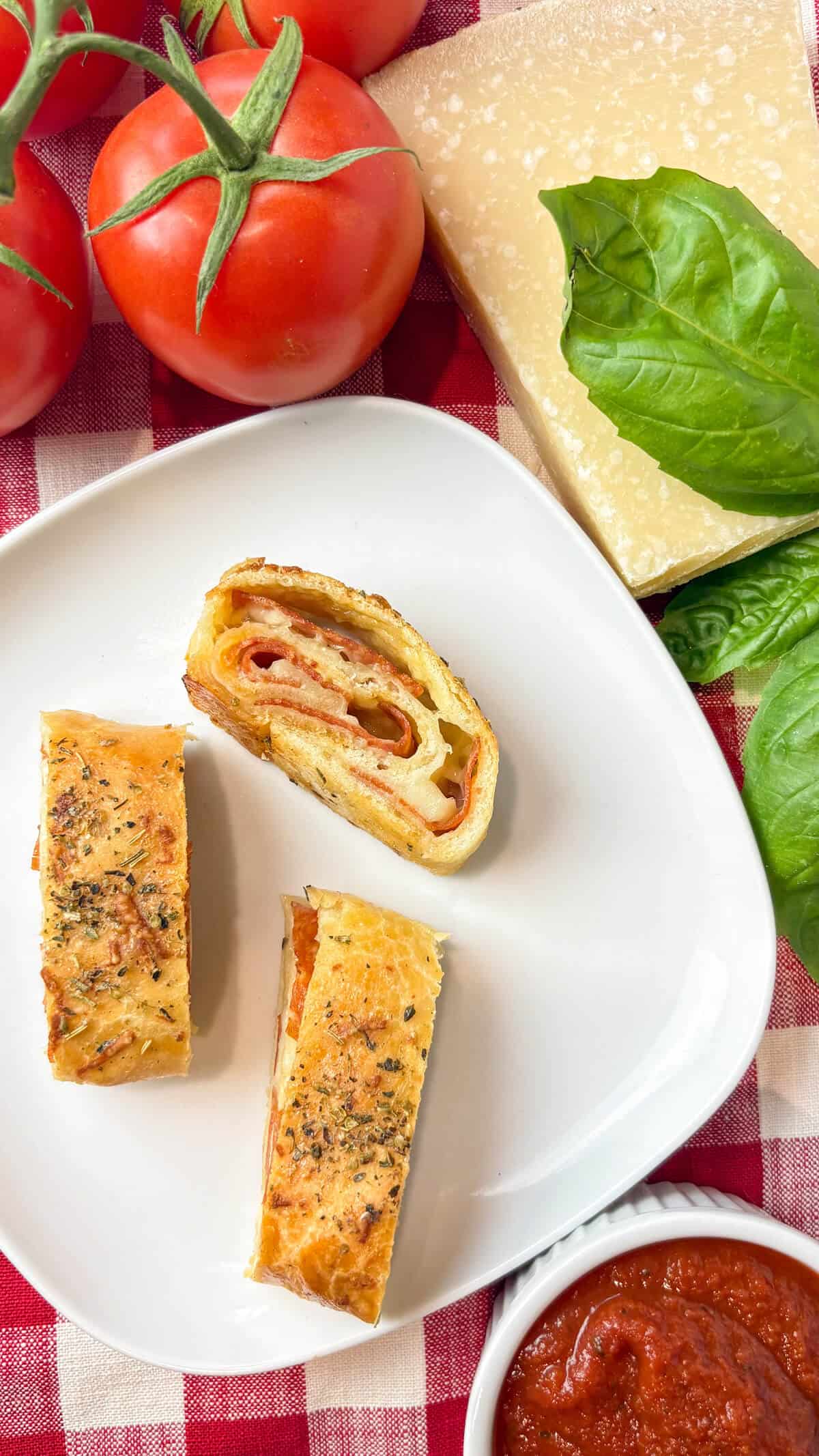 Pepperoni roll bread on a plate.