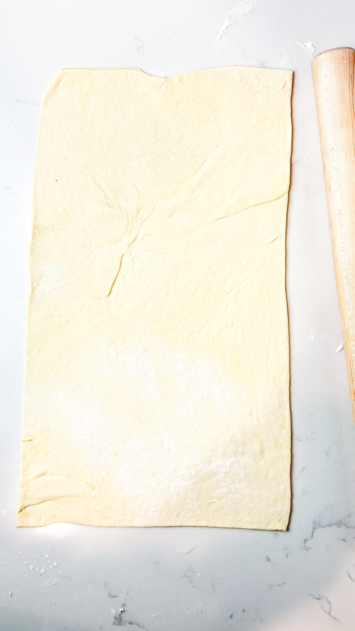 Dough rolled out on the countertop.