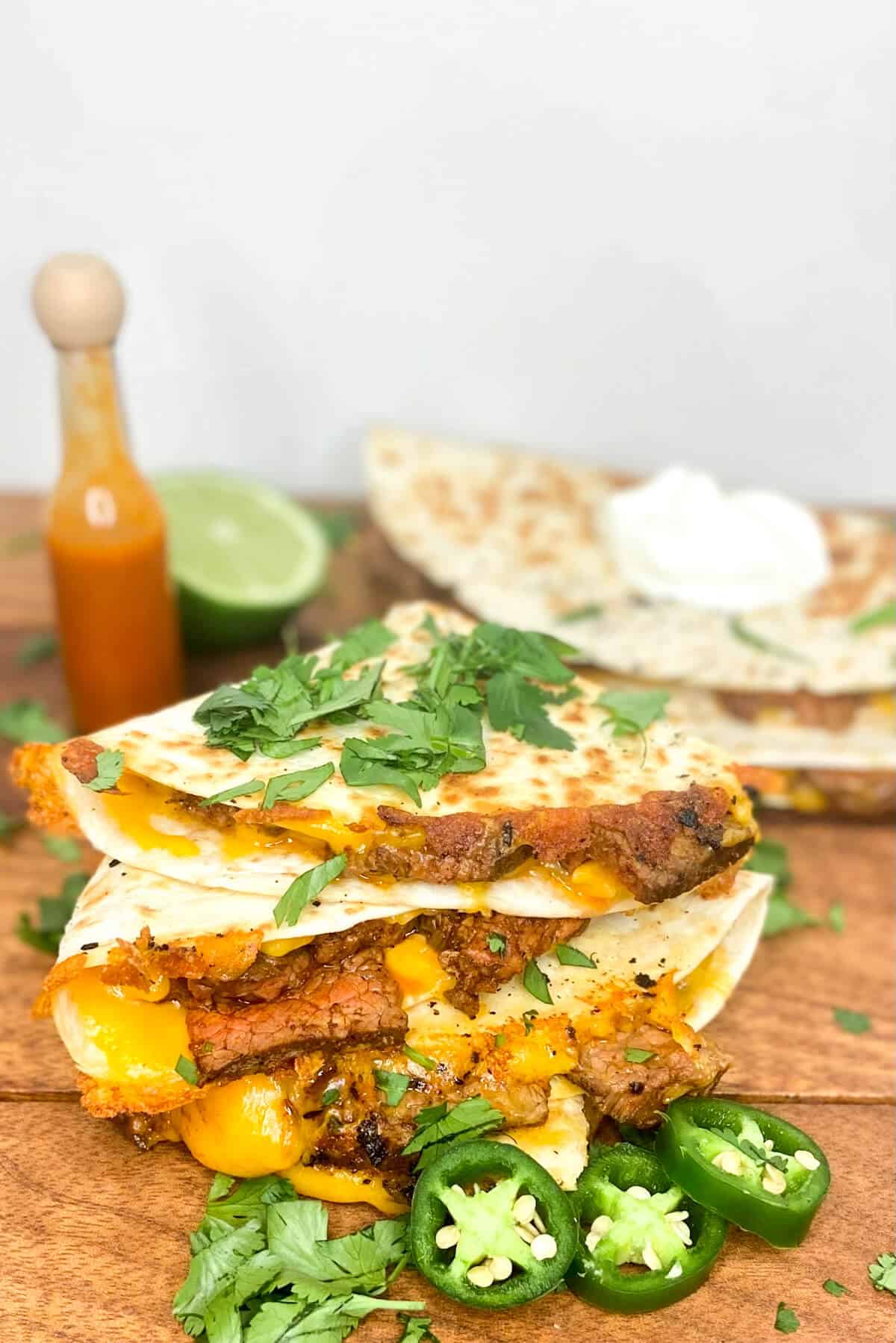 Quesadillas served with herbs sprinkled on top.