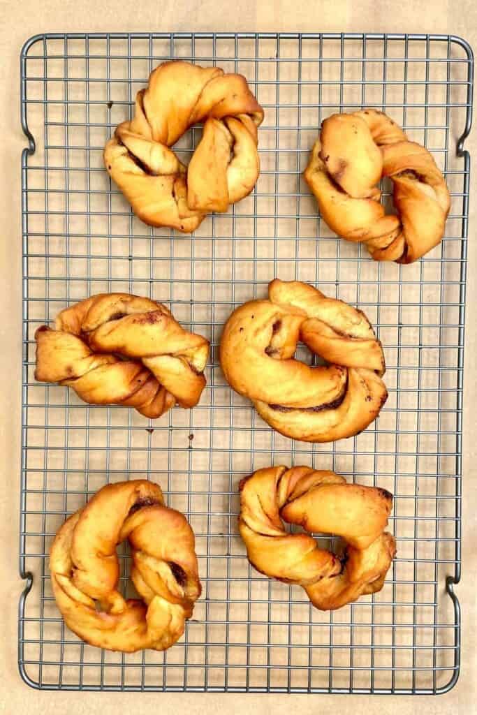Cinnamon Roll Donuts - cooling donuts on rack