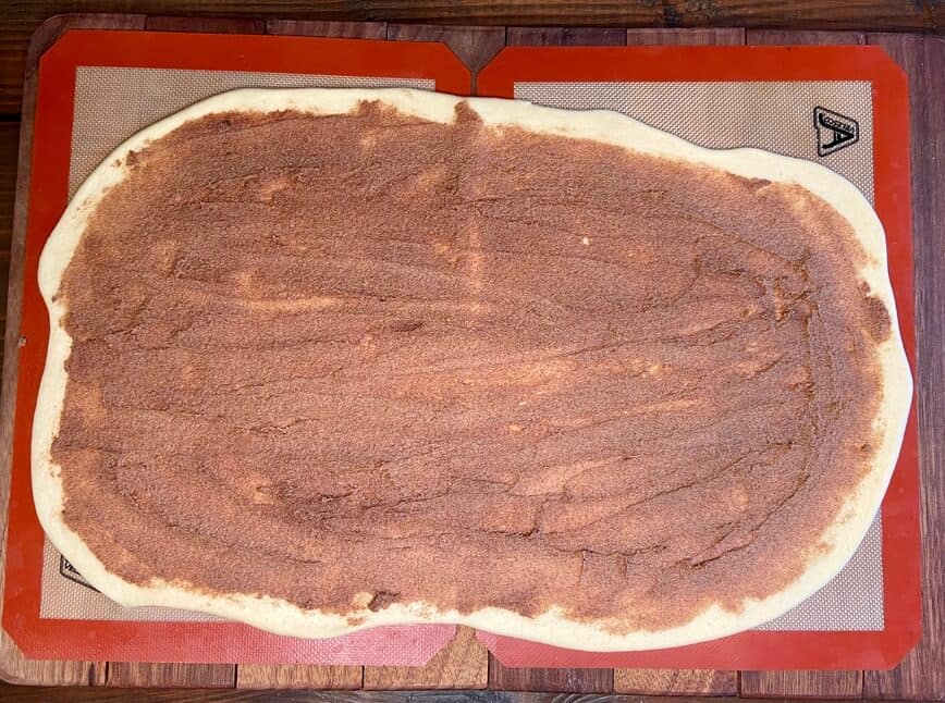 Cinnamon Roll Donuts - filling spread over dough