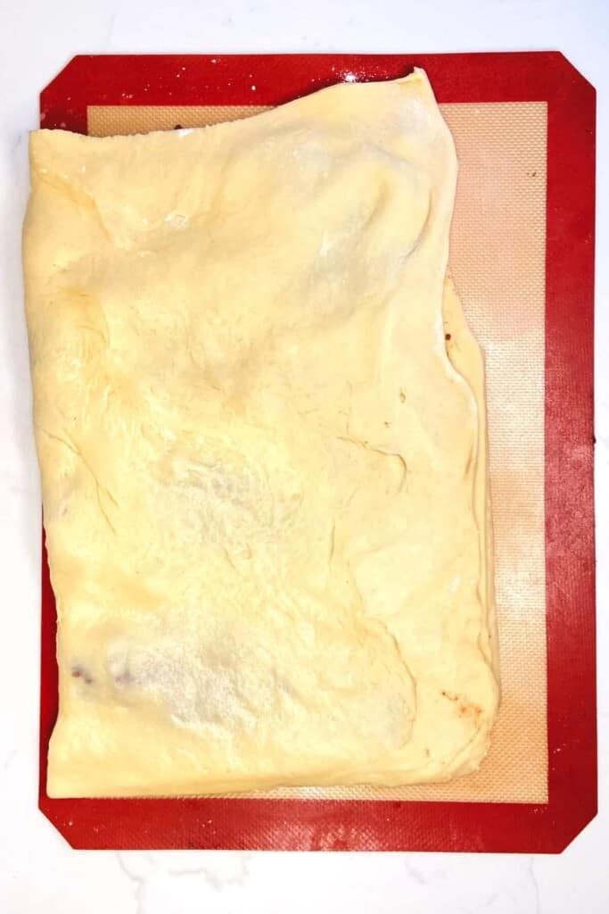 Cinnamon Roll Donuts - folding dough in half