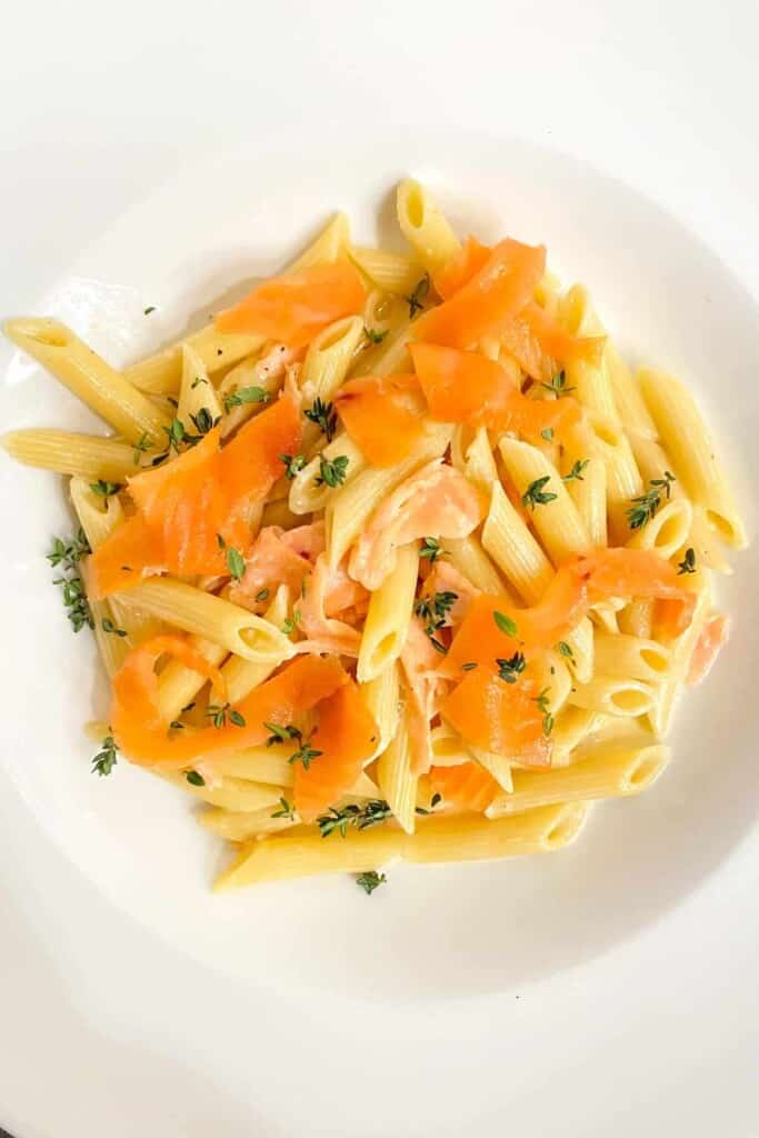 Penne with Cream and Smoked Salmon - Plate and add remaining uncooked salmon, garnish with thyme