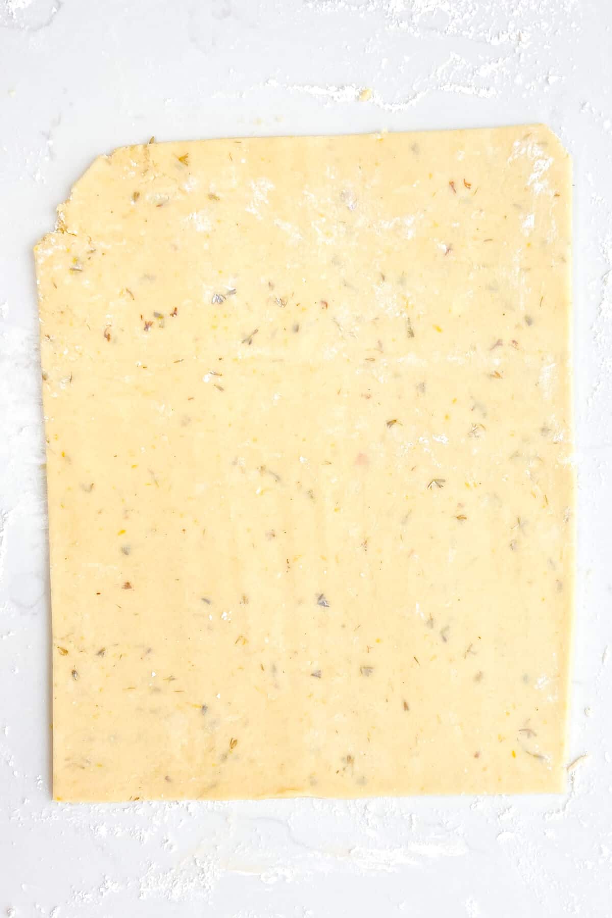 Cookie dough rolled out into a rectangle.