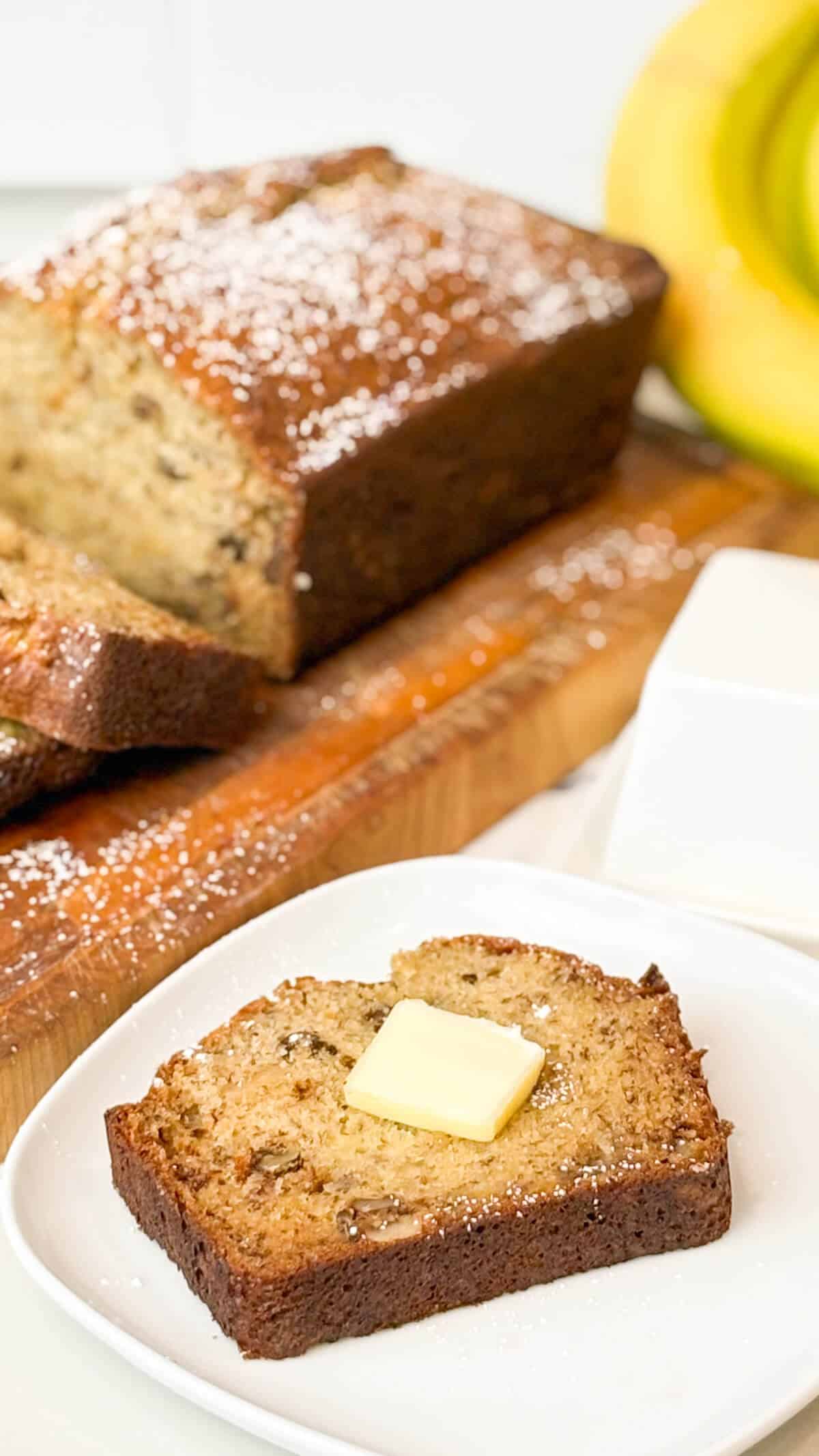 Sliced piece with a pat of butter on top.