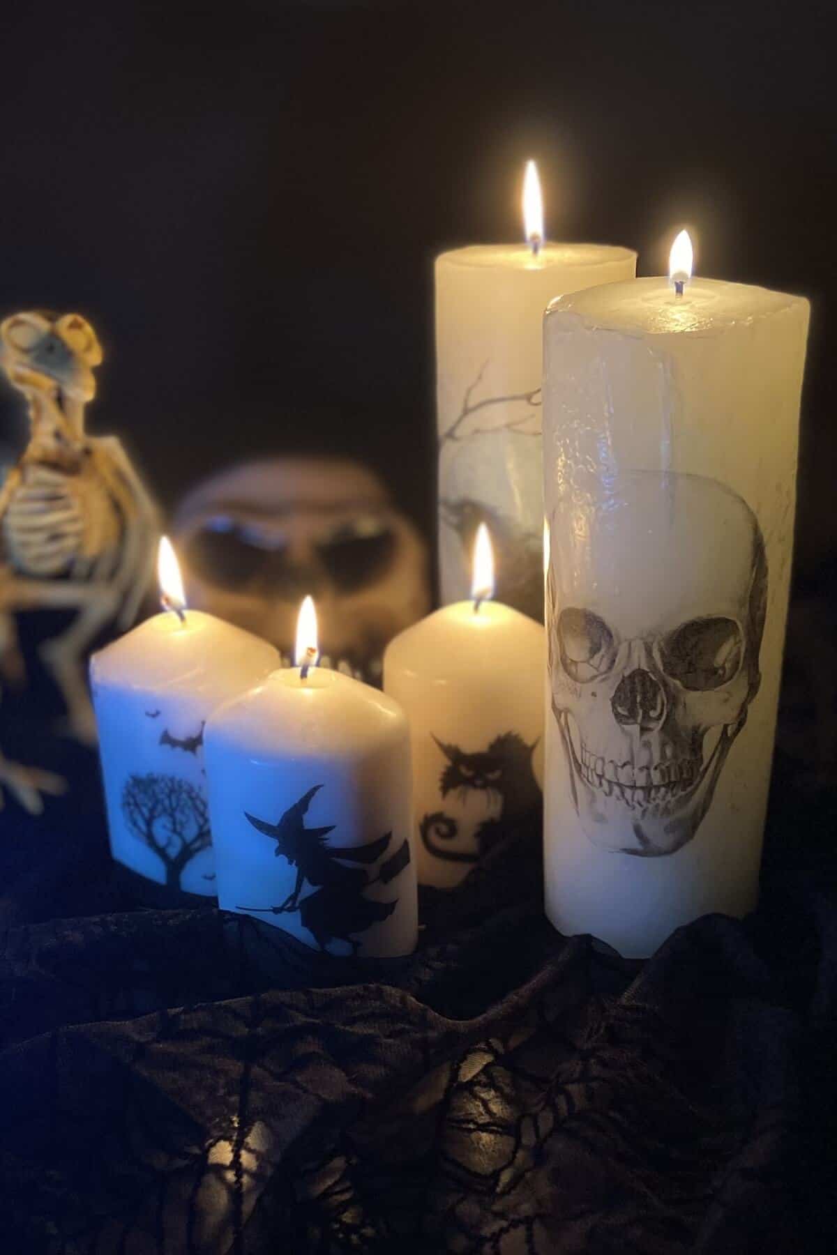Lit candles with skeleton.