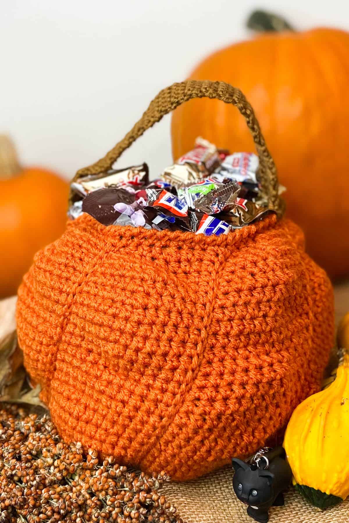 Bag with candy, with real pumpkins nearby