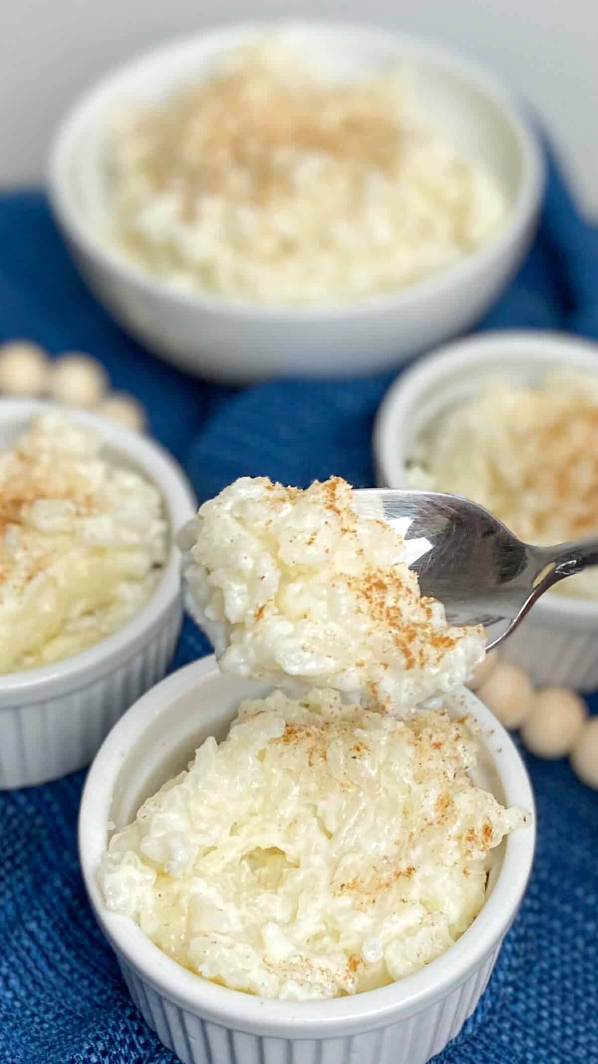 Scooping out a spoonful of rice pudding.