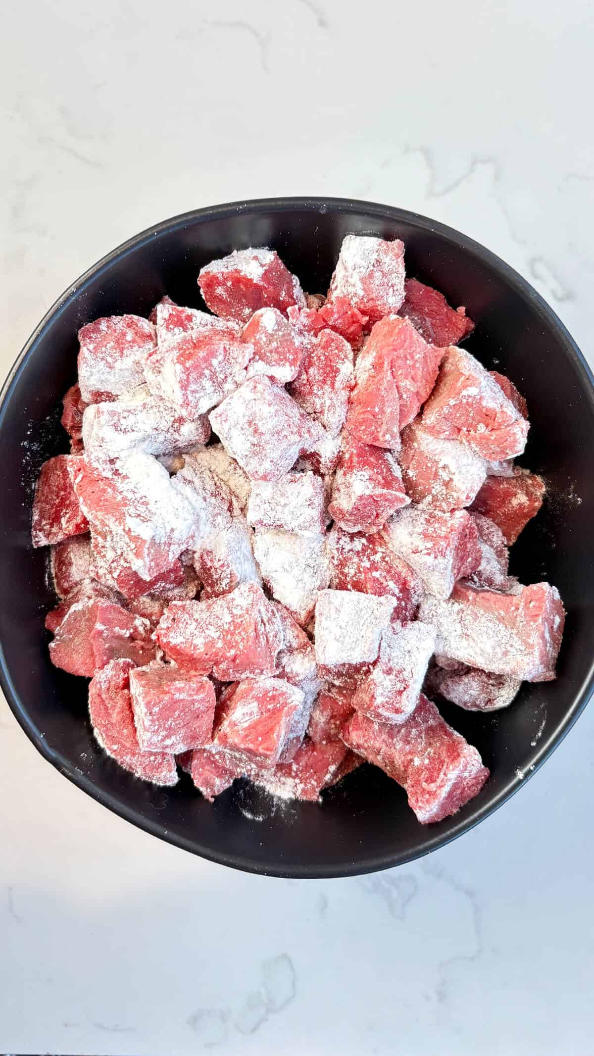 Beef tossed with salt, pepper, and flour.