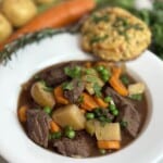 Crockpot beef stew, in a shallow bowl.